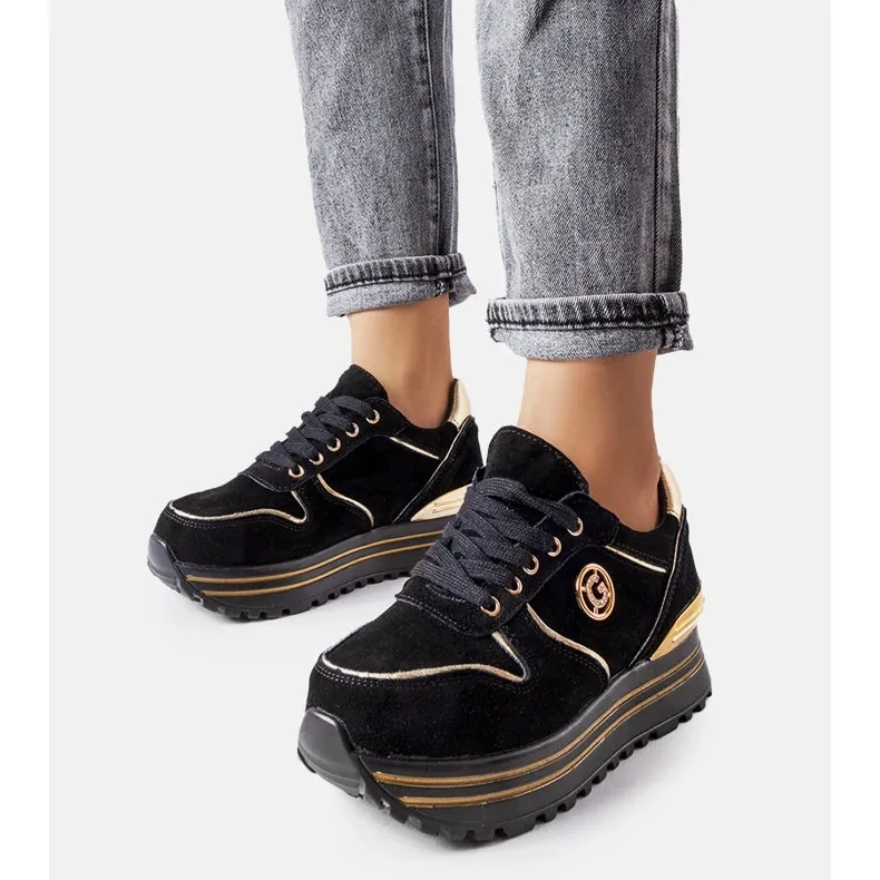 Black and gold platform sneakers from Therrien