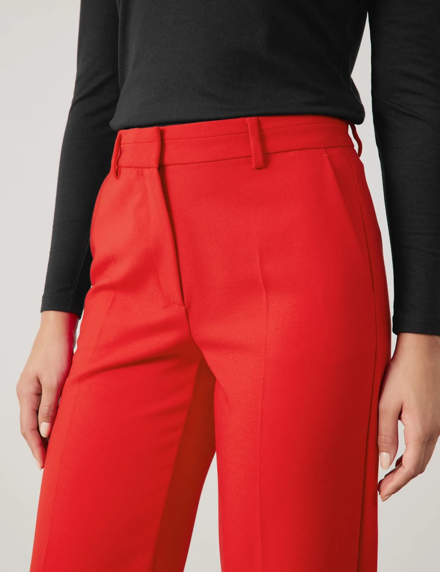 Flowing trousers with pressed pleats