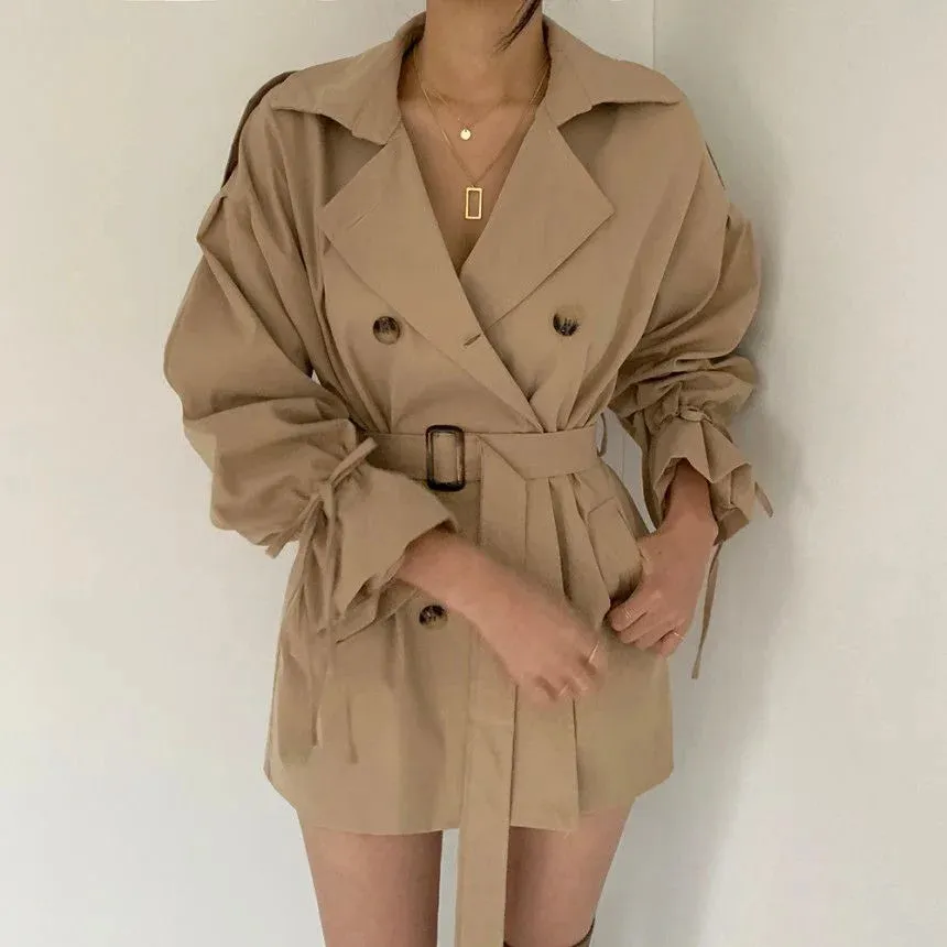 Minimalist women's trench coat with a belt