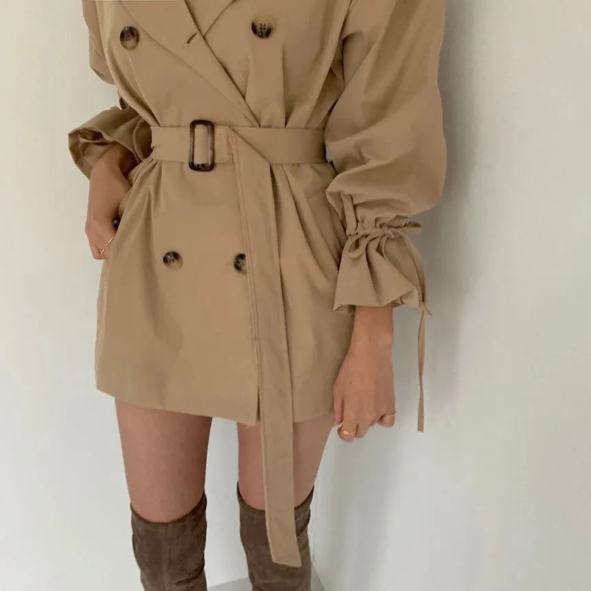 Minimalist women's trench coat with a belt