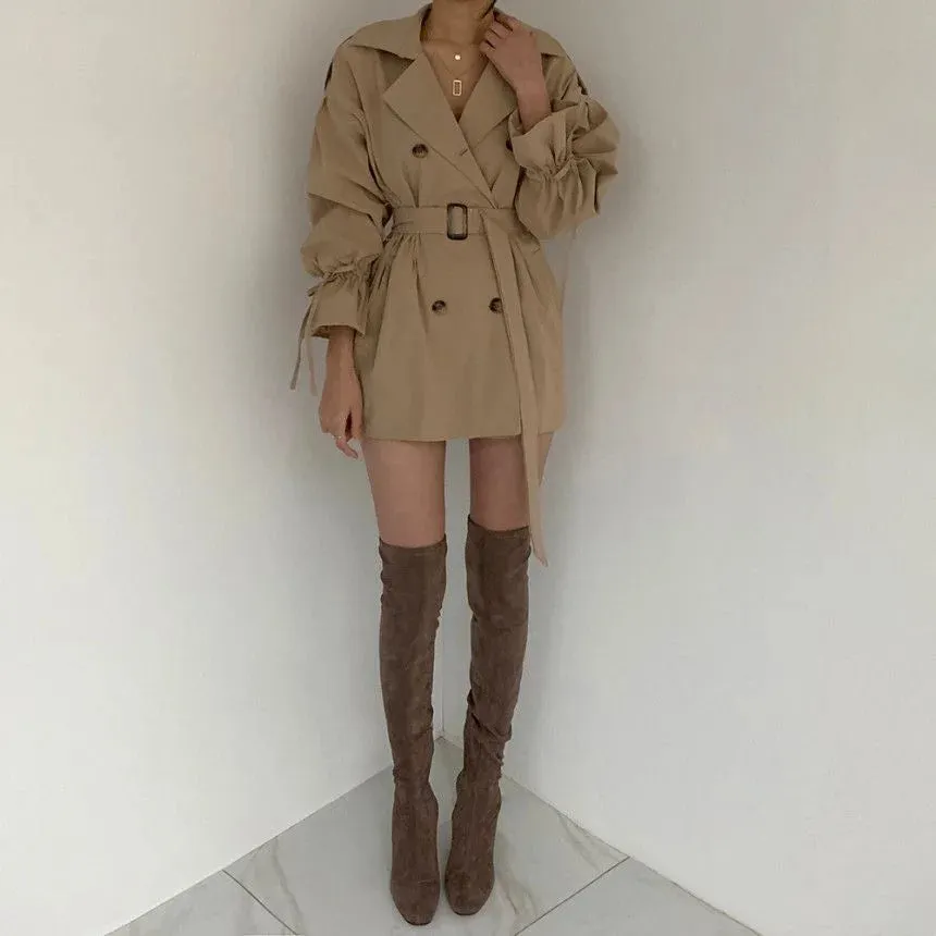 Minimalist women's trench coat with a belt